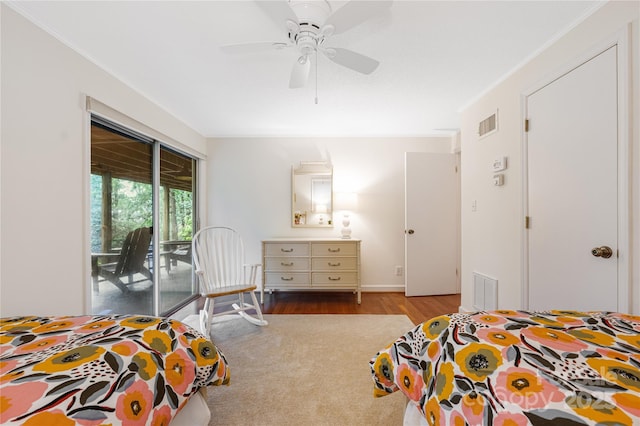 1207 Ridge Rd Unit 25, Glade Valley, NC 28627 - bedroom with access to exterior, wood finished floors, crown molding, a ceiling fan, and baseboards