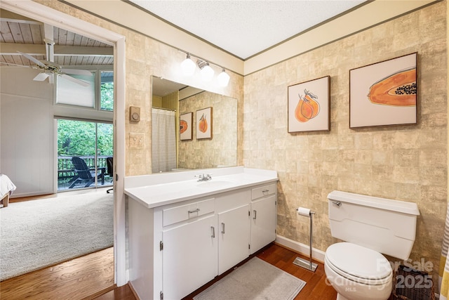 1207 Ridge Rd Unit 25, Glade Valley, NC 28627 - bathroom with wood finished floors, vanity, a ceiling fan, and toilet