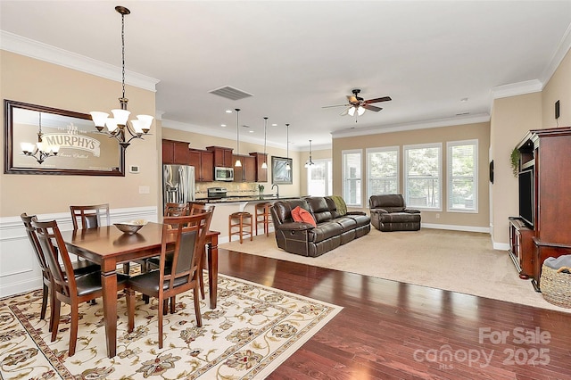 1397 Tupelo Rd, Clover, SC 29710 - dining space featuring a chandelier, a ceiling fan, crown molding, light wood-style floors, and recessed lighting