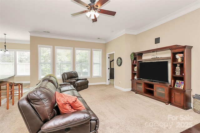 1397 Tupelo Rd, Clover, SC 29710 - living room featuring a ceiling fan, crown molding, baseboards, carpet flooring, and healthy amount of natural light