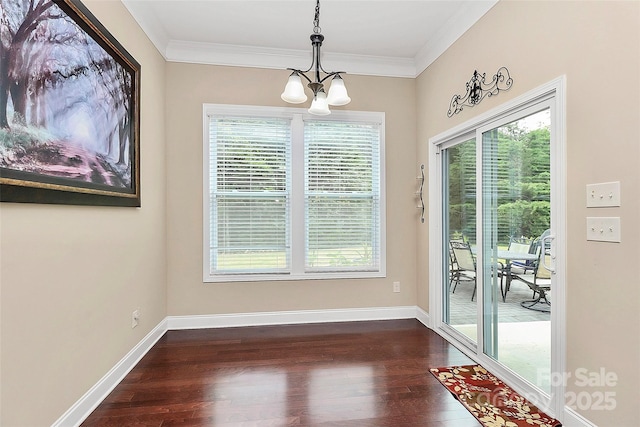 1397 Tupelo Rd, Clover, SC 29710 - unfurnished dining area with dark wood-style flooring, a chandelier, plenty of natural light, crown molding, and baseboards