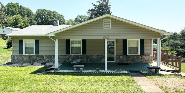 820 NE Seehorn St NE, Lenoir, NC 28645 - view of front of property featuring stone siding, a front yard, and a porch