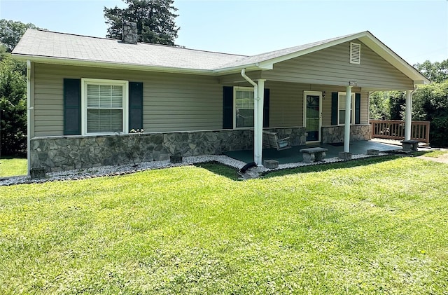 820 NE Seehorn St NE, Lenoir, NC 28645 - view of front of home featuring stone siding, a front lawn, a chimney, and covered porch
