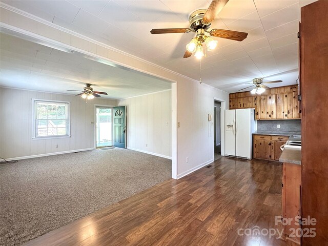 820 NE Seehorn St NE, Lenoir, NC 28645 - unfurnished living room with ceiling fan, crown molding, dark wood-type flooring, and baseboards