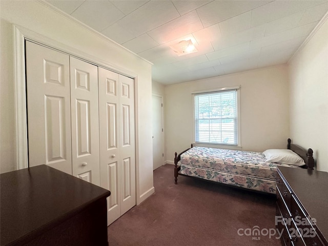 820 NE Seehorn St NE, Lenoir, NC 28645 - carpeted bedroom featuring crown molding, a closet, and baseboards