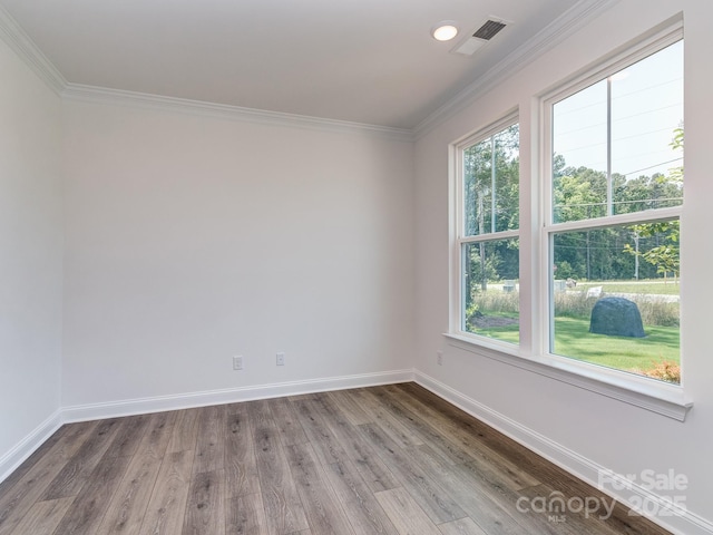7108 Hambright Rd, Huntersville, NC 28078 - spare room with wood finished floors, baseboards, and ornamental molding