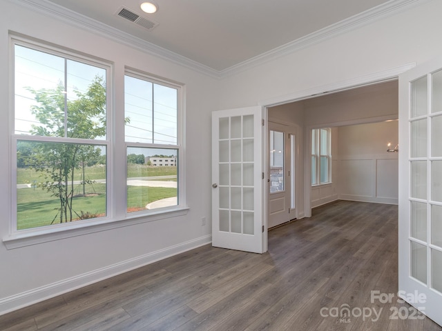 7108 Hambright Rd, Huntersville, NC 28078 - spare room featuring french doors, ornamental molding, wood finished floors, and baseboards