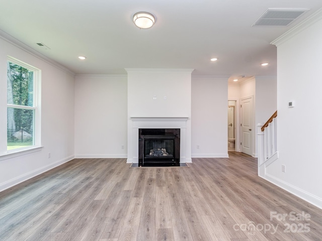 7108 Hambright Rd, Huntersville, NC 28078 - unfurnished living room with wood finished floors, stairs, a fireplace with flush hearth, ornamental molding, and baseboards