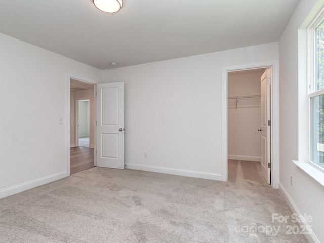 7108 Hambright Rd, Huntersville, NC 28078 - unfurnished bedroom featuring carpet floors, baseboards, and a spacious closet