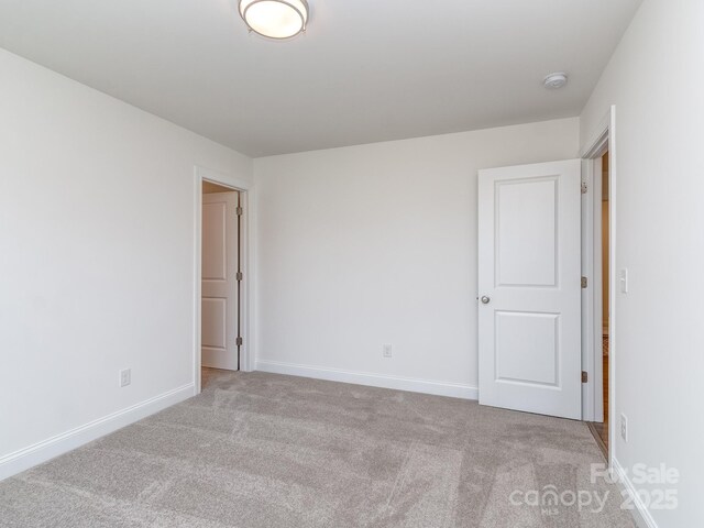 7108 Hambright Rd, Huntersville, NC 28078 - unfurnished room featuring carpet floors, baseboards, and a smoke detector