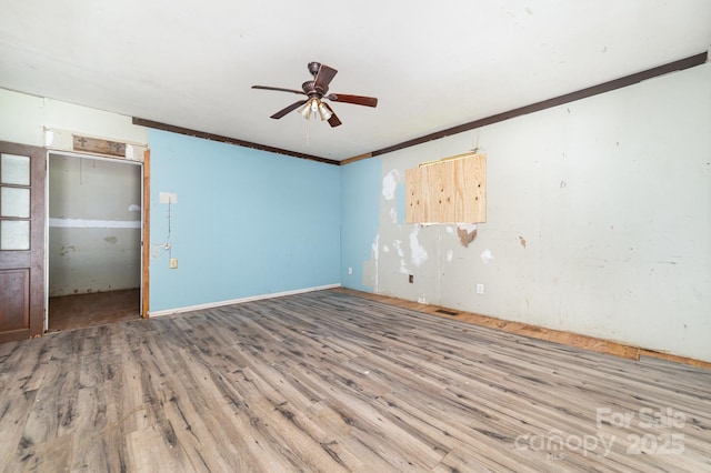 245 Walt Corriher Rd, China Grove, NC 28023 - unfurnished room featuring wood finished floors, a ceiling fan, and crown molding