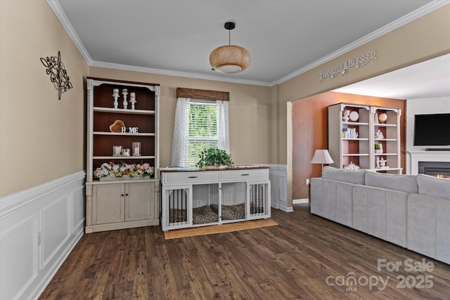 301 Wheat Field Dr, Mount Holly, NC 28120 - living room with ornamental molding, a lit fireplace, dark wood-style flooring, and wainscoting