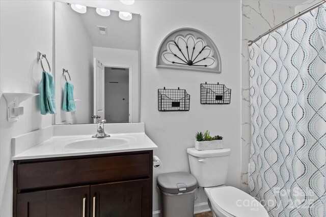 301 Wheat Field Dr, Mount Holly, NC 28120 - full bath featuring vanity, toilet, a shower with curtain, and baseboards