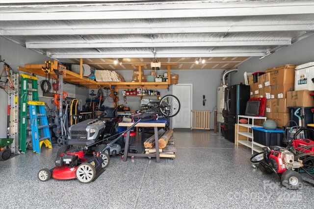 301 Wheat Field Dr, Mount Holly, NC 28120 - garage with freestanding refrigerator
