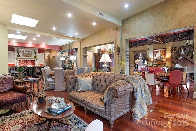 231 N Main St, Hendersonville, NC 28792 - living area with wood finished floors, a skylight, and a towering ceiling