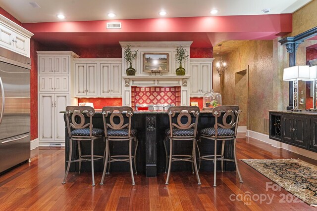231 N Main St, Hendersonville, NC 28792 - bar area with built in refrigerator and dark wood-style flooring