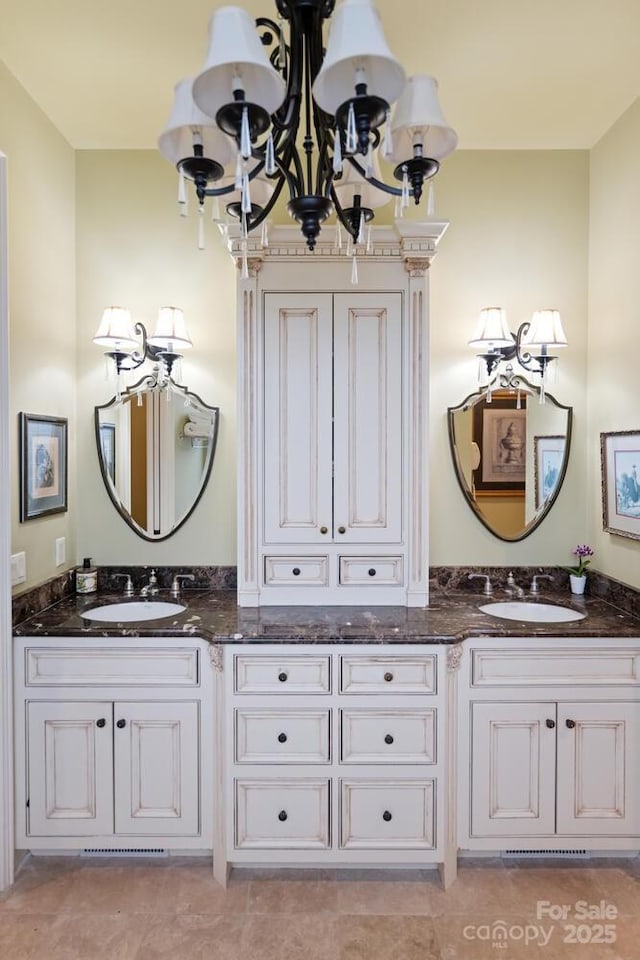 231 N Main St, Hendersonville, NC 28792 - bathroom with a chandelier and double vanity