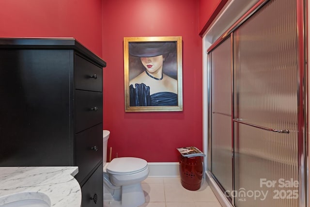 231 N Main St, Hendersonville, NC 28792 - full bath with a shower stall, tile patterned floors, vanity, and toilet