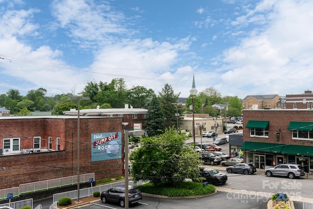 231 N Main St, Hendersonville, NC 28792 - view of asphalt road with curbs and street lighting