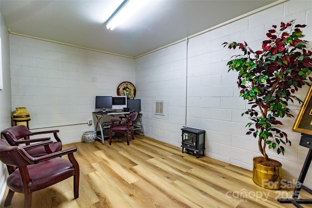 1028 Washburn Switch Rd, Shelby, NC 28150 - office featuring a wood stove, wood finished floors, and ornamental molding