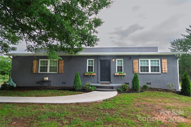 1028 Washburn Switch Rd, Shelby, NC 28150 - single story home with crawl space, brick siding, and a front yard