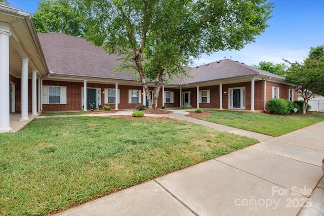 7138 Somerset Springs Dr, Charlotte, NC 28262 - single story home featuring brick siding, a front yard, and roof with shingles
