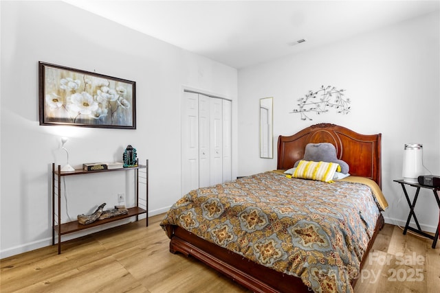 7138 Somerset Springs Dr, Charlotte, NC 28262 - bedroom featuring wood finished floors and a closet