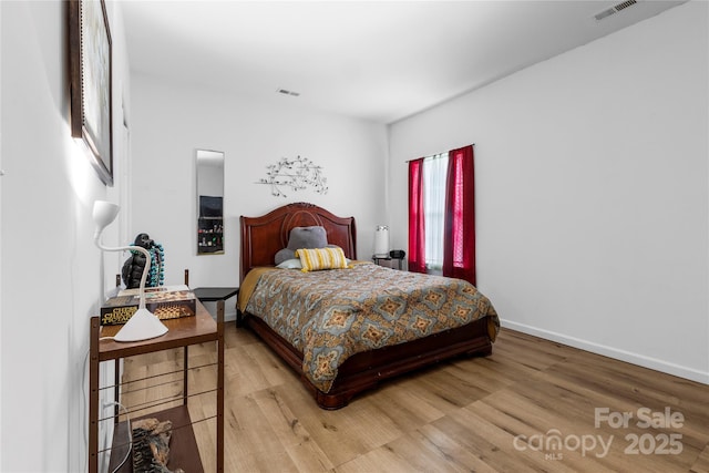 7138 Somerset Springs Dr, Charlotte, NC 28262 - bedroom featuring wood finished floors and baseboards