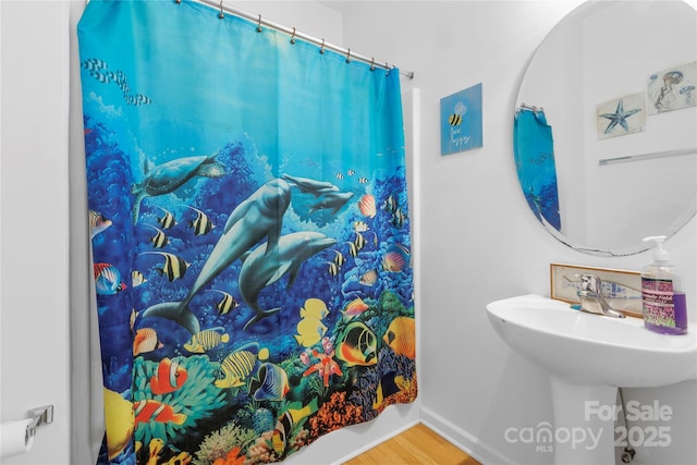 7138 Somerset Springs Dr, Charlotte, NC 28262 - full bathroom featuring wood finished floors and a shower with curtain