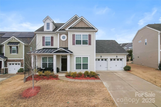 966 NW Parkland Pl, Concord, NC 28027 - view of front of property with driveway, an attached garage, a standing seam roof, board and batten siding, and roof with shingles