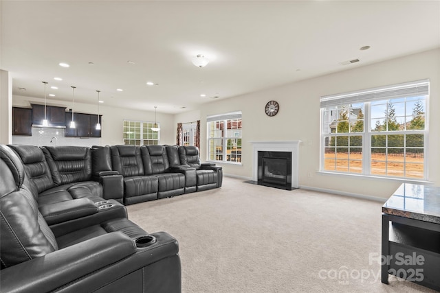 966 NW Parkland Pl, Concord, NC 28027 - living room featuring light colored carpet, recessed lighting, baseboards, and a fireplace with flush hearth
