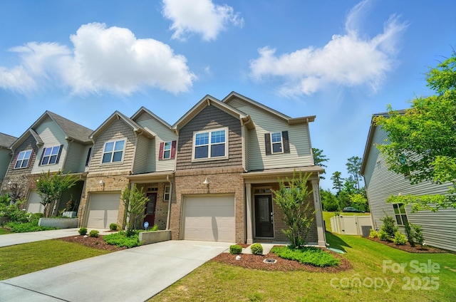 5334 Orchid Bloom Dr, Fort Mill, SC 29707 - view of front of house with concrete driveway, brick siding, and an attached garage