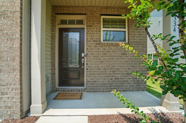 5334 Orchid Bloom Dr, Fort Mill, SC 29707 - doorway to property featuring brick siding and a porch