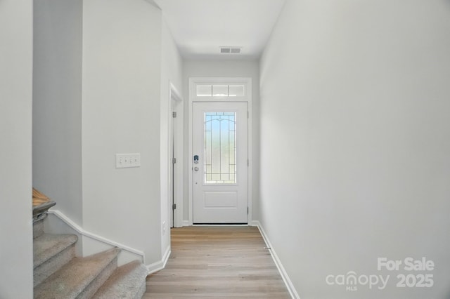 5334 Orchid Bloom Dr, Fort Mill, SC 29707 - doorway to outside with light wood-style flooring, baseboards, and stairway