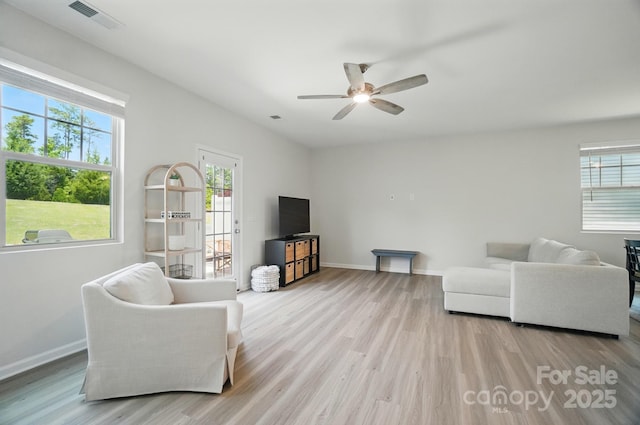 5334 Orchid Bloom Dr, Fort Mill, SC 29707 - living area featuring wood finished floors, healthy amount of natural light, a ceiling fan, and baseboards