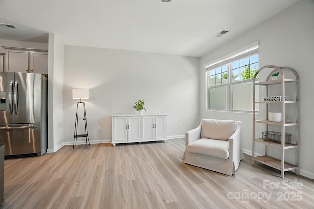 5334 Orchid Bloom Dr, Fort Mill, SC 29707 - living area featuring light wood-style flooring and baseboards