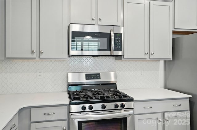 5334 Orchid Bloom Dr, Fort Mill, SC 29707 - kitchen featuring appliances with stainless steel finishes, light countertops, and backsplash