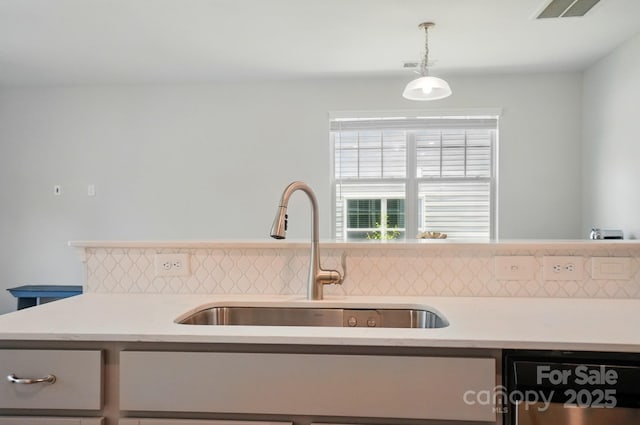 5334 Orchid Bloom Dr, Fort Mill, SC 29707 - kitchen featuring a sink, dishwasher, light countertops, and backsplash
