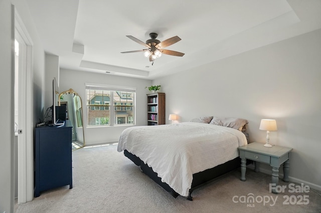 5334 Orchid Bloom Dr, Fort Mill, SC 29707 - bedroom with a raised ceiling, light carpet, baseboards, and ceiling fan