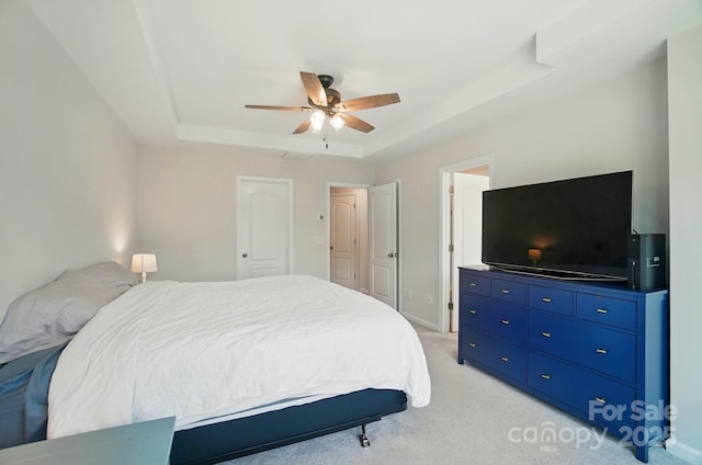 5334 Orchid Bloom Dr, Fort Mill, SC 29707 - bedroom with a tray ceiling, light colored carpet, a ceiling fan, and baseboards