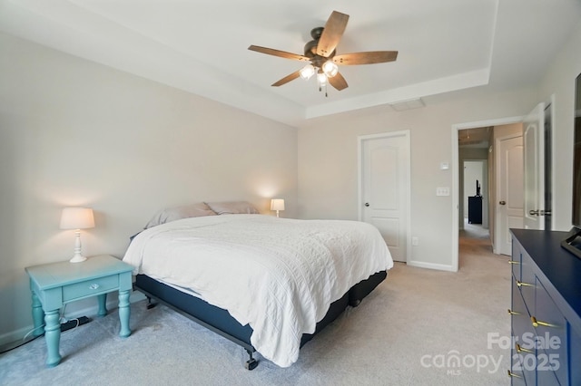 5334 Orchid Bloom Dr, Fort Mill, SC 29707 - bedroom with a tray ceiling, light colored carpet, baseboards, and ceiling fan