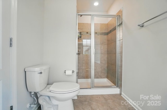 5334 Orchid Bloom Dr, Fort Mill, SC 29707 - bathroom with toilet, tile patterned flooring, a shower stall, baseboards, and recessed lighting