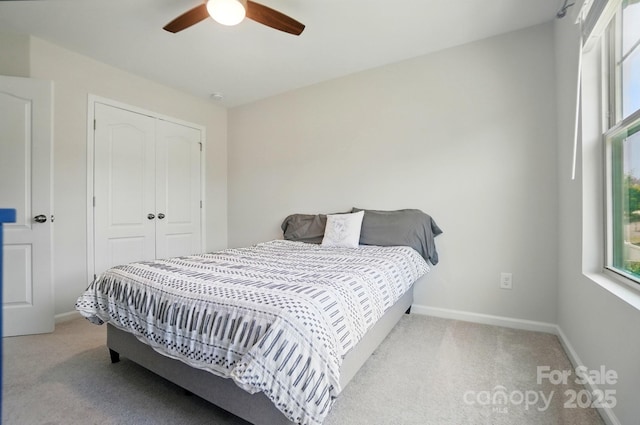 5334 Orchid Bloom Dr, Fort Mill, SC 29707 - bedroom with carpet, a closet, baseboards, and ceiling fan