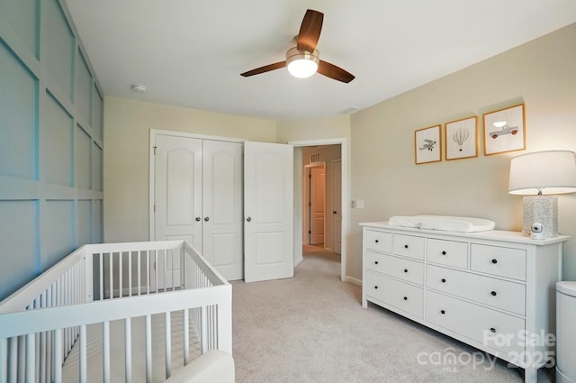 5334 Orchid Bloom Dr, Fort Mill, SC 29707 - bedroom with light carpet, a closet, a nursery area, and ceiling fan