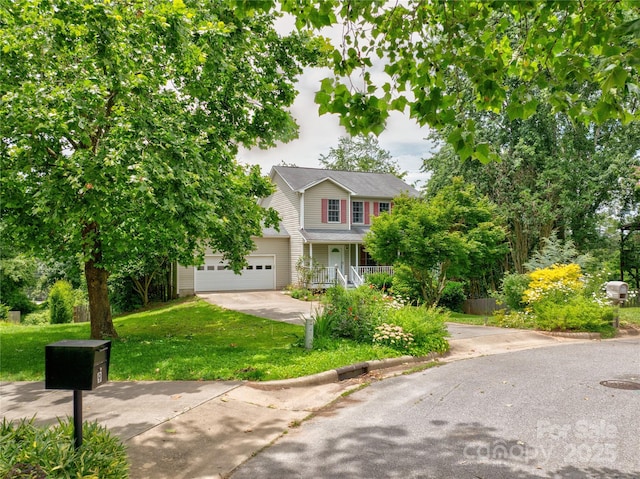 7 Mill Stone Dr, Asheville, NC 28803 - view of front facade with concrete driveway, a front yard, and covered porch
