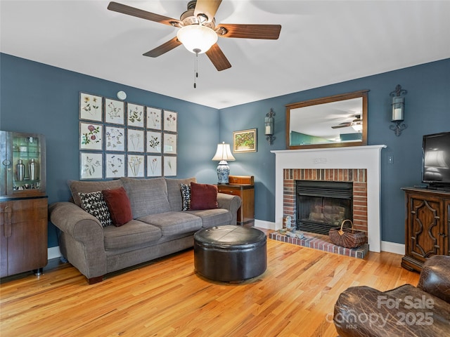 7 Mill Stone Dr, Asheville, NC 28803 - living room featuring ceiling fan, wood finished floors, and a fireplace