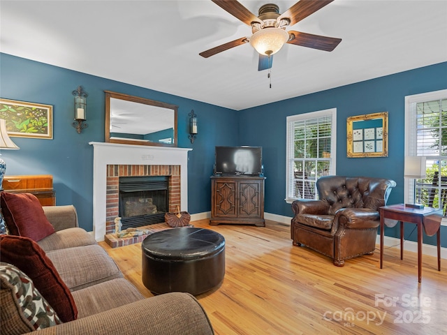 7 Mill Stone Dr, Asheville, NC 28803 - living area with wood finished floors, ceiling fan, and a fireplace