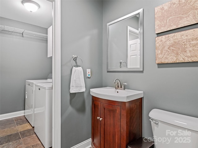 7 Mill Stone Dr, Asheville, NC 28803 - bathroom with separate washer and dryer, stone finish floors, and vanity