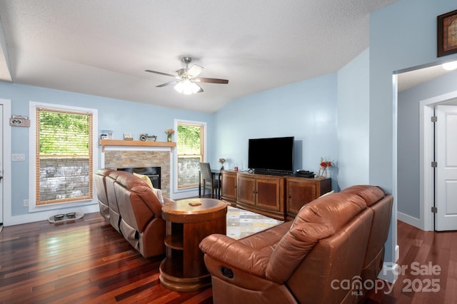 178 Susanna Cove Rd, Mars Hill, NC 28754 - living room with wood finished floors, a ceiling fan, vaulted ceiling, plenty of natural light, and a fireplace