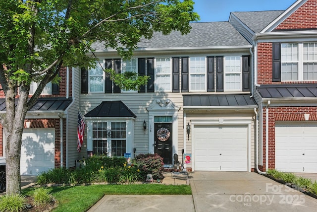 158 Snead Rd, Fort Mill, SC 29715 - townhome / multi-family property with brick siding, a garage, concrete driveway, roof with shingles, and a standing seam roof